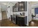 Modern kitchen with stainless steel appliances, granite countertops, and dark wood cabinets at 4237 William E Murray Blvd, Charleston, SC 29414