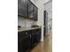 Kitchen details with stainless steel appliances, granite countertops, and dark wood cabinets at 4237 William E Murray Blvd, Charleston, SC 29414
