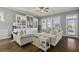 Inviting living room with hardwood floors, ceiling fan, and a cozy seating arrangement at 4237 William E Murray Blvd, Charleston, SC 29414
