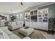 Bright and open living room with hardwood floors, built-in shelving, and neutral decor at 4237 William E Murray Blvd, Charleston, SC 29414