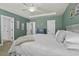 Serene main bedroom with a decorative ceiling, fan, and elegant furnishings at 4237 William E Murray Blvd, Charleston, SC 29414
