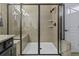 Modern tiled shower with a glass door and a built-in bench at 4237 William E Murray Blvd, Charleston, SC 29414