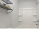 A bathroom features a shower and tub combo with built-in shelves and chrome fixtures at 4678 Palm View Cir, North Charleston, SC 29418