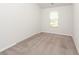 A bright, empty bedroom with neutral carpet and a window with natural light at 4678 Palm View Cir, North Charleston, SC 29418