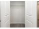 A shelved, walk-in closet with carpeted floor provides ample storage space at 4678 Palm View Cir, North Charleston, SC 29418