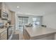 Open kitchen with island, stainless steel appliances and lots of natural light at 4678 Palm View Cir, North Charleston, SC 29418