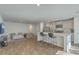 Open-concept design seamlessly connects the kitchen and living area, creating an inviting atmosphere at 4678 Palm View Cir, North Charleston, SC 29418