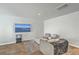Cozy living room featuring hardwood floors, modern furniture, and a large screen television at 4678 Palm View Cir, North Charleston, SC 29418
