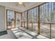 Relaxing screened porch with wood framing and views of the lush surrounding greenery at 4808 Hearthside Dr, Summerville, SC 29485