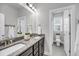 Bright bathroom with double sinks, granite countertops, and a toilet room at 524 Amalie Farms Dr, Charleston, SC 29492