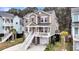 Beautiful elevated home featuring a spacious driveway, and manicured landscaping at 524 Amalie Farms Dr, Charleston, SC 29492
