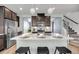 Modern kitchen with stainless steel appliances, granite countertops, and stylish island seating at 524 Amalie Farms Dr, Charleston, SC 29492