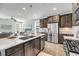 Modern kitchen with stainless steel appliances, granite countertops, and elegant pendant lighting at 524 Amalie Farms Dr, Charleston, SC 29492