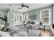 Comfortable living room featuring an inviting sofa, ceiling fan, stylish decor and french doors at 524 Amalie Farms Dr, Charleston, SC 29492