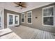 Covered deck with white railings and a view of the yard at 524 Amalie Farms Dr, Charleston, SC 29492