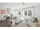 Bright living room featuring a white sofa, a ceiling fan, and natural light at 5567 Ruby Falls Drive Ln, North Charleston, SC 29420