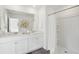 Bright bathroom featuring double vanity, modern fixtures, and a convenient shower with a white curtain at 5569 Ruby Falls Drive Ln, North Charleston, SC 29420