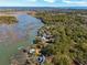 Breathtaking aerial perspective of waterfront homes, winding rivers, and lush greenery at 601 Foredeck Ln, Edisto Island, SC 29438