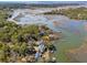 Stunning aerial view of homes along a marshy waterfront with private docks at 601 Foredeck Ln, Edisto Island, SC 29438