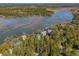 Picturesque aerial view of waterfront homes surrounded by beautiful waterways and abundant trees at 601 Foredeck Ln, Edisto Island, SC 29438