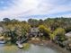 Beautiful waterfront home with a private dock and surrounded by lush trees at 601 Foredeck Ln, Edisto Island, SC 29438