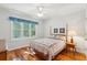 Bedroom featuring hardwood floors, a bed, and a window at 601 Foredeck Ln, Edisto Island, SC 29438