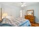 Bright bedroom with neutral colors, hardwood floors, a bed and dresser at 601 Foredeck Ln, Edisto Island, SC 29438
