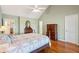 Spacious bedroom featuring hardwood floors, a bed, dresser and good natural light at 601 Foredeck Ln, Edisto Island, SC 29438