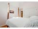 Bright bedroom featuring a wooden four poster bed, light walls and carpet at 601 Foredeck Ln, Edisto Island, SC 29438