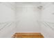 Walk-in closet featuring wood floors and metal shelving at 601 Foredeck Ln, Edisto Island, SC 29438