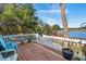 Relaxing deck with chairs overlooking lush trees, a view of the waterway at 601 Foredeck Ln, Edisto Island, SC 29438