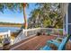 Relaxing deck with chairs overlooking lush trees, a view of the waterway at 601 Foredeck Ln, Edisto Island, SC 29438