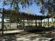 Wooden pavilion with benches and picnic tables overlooking the waterway at 601 Foredeck Ln, Edisto Island, SC 29438