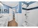 Well-appointed bathroom featuring a shower with tile and blue accent trim at 601 Pompano Rd, Edisto Island, SC 29438