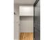 Open, empty closet with hardwood flooring and white walls at 7 Logan St # F, Charleston, SC 29401