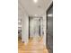 Hallway view featuring hardwood floors and doorways to various rooms at 7 Logan St # F, Charleston, SC 29401