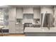Well-appointed kitchen featuring modern appliances, white countertops, and sleek cabinets at 7 Logan St # F, Charleston, SC 29401