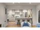 Modern kitchen with stainless appliances, eat in bar, and statement wall paper at 7 Logan St # F, Charleston, SC 29401