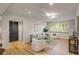 Cozy living room features hardwood floors, neutral walls, and ample natural light at 7 Logan St # F, Charleston, SC 29401