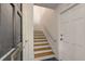 View of the stairs, hallway, and doors at 7 Logan St # F, Charleston, SC 29401