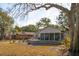 Charming backyard with a screened porch and deck, providing the perfect space for relaxation and entertaining at 728 N Godfrey Park Pl, Charleston, SC 29407