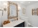 Charming bathroom with unique mirror and marble countertop sink at 728 N Godfrey Park Pl, Charleston, SC 29407