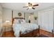 Cozy bedroom featuring a four-poster bed, wood floors, and neutral decor at 728 N Godfrey Park Pl, Charleston, SC 29407