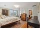 Bedroom with a four-poster bed, an area rug and ample natural light at 728 N Godfrey Park Pl, Charleston, SC 29407