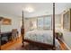 Bedroom featuring a four-poster bed, an area rug and ample natural light at 728 N Godfrey Park Pl, Charleston, SC 29407