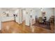 Open concept dining area with hardwood floors, light walls, and an open access to the kitchen at 728 N Godfrey Park Pl, Charleston, SC 29407
