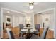 Open dining area with hardwood floors, leading to the kitchen, bedroom and bathroom at 728 N Godfrey Park Pl, Charleston, SC 29407