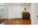 Bright entryway featuring hardwood floors, antique desk, and neutral walls at 728 N Godfrey Park Pl, Charleston, SC 29407