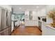 Modern kitchen with stainless steel appliances, white cabinets, and granite countertops at 728 N Godfrey Park Pl, Charleston, SC 29407