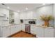 Well-lit kitchen featuring white cabinets, stainless steel appliances, and a subway tile backsplash at 728 N Godfrey Park Pl, Charleston, SC 29407